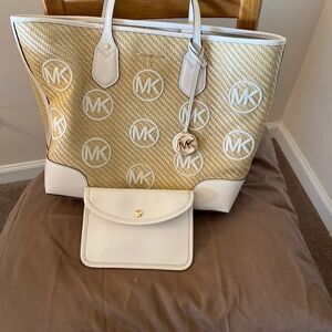 Michael Kors Tote Bag with a smaller leather pouch.